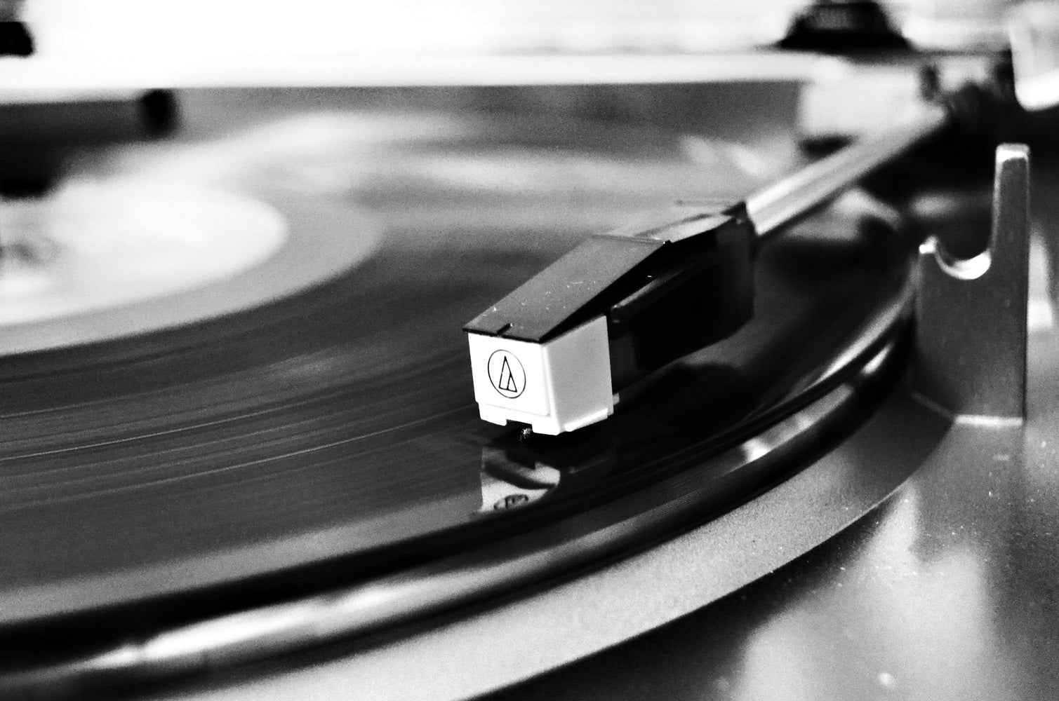 black custom vinyl record on a turntable