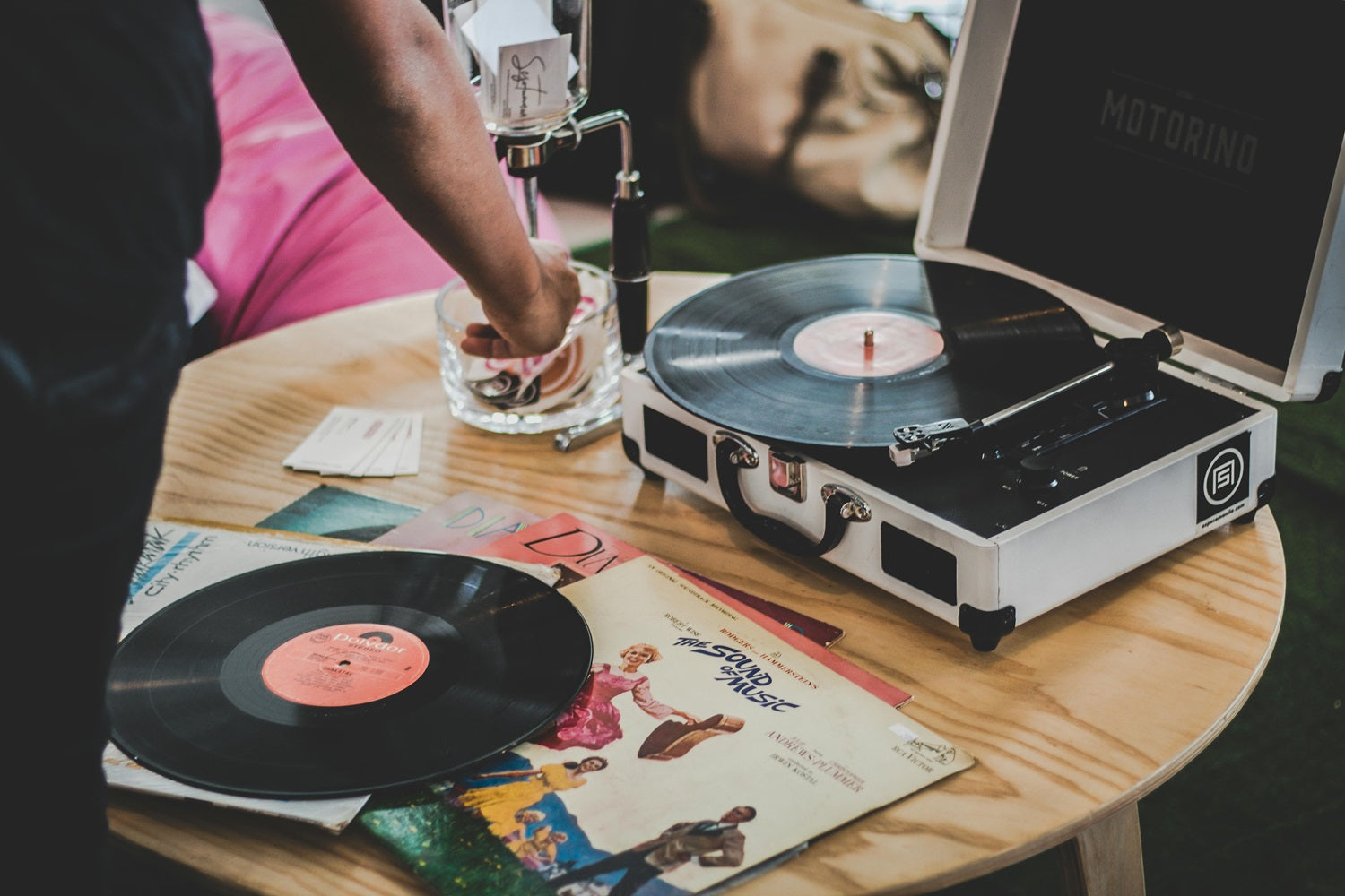 vinyl records on turntable and in a stack